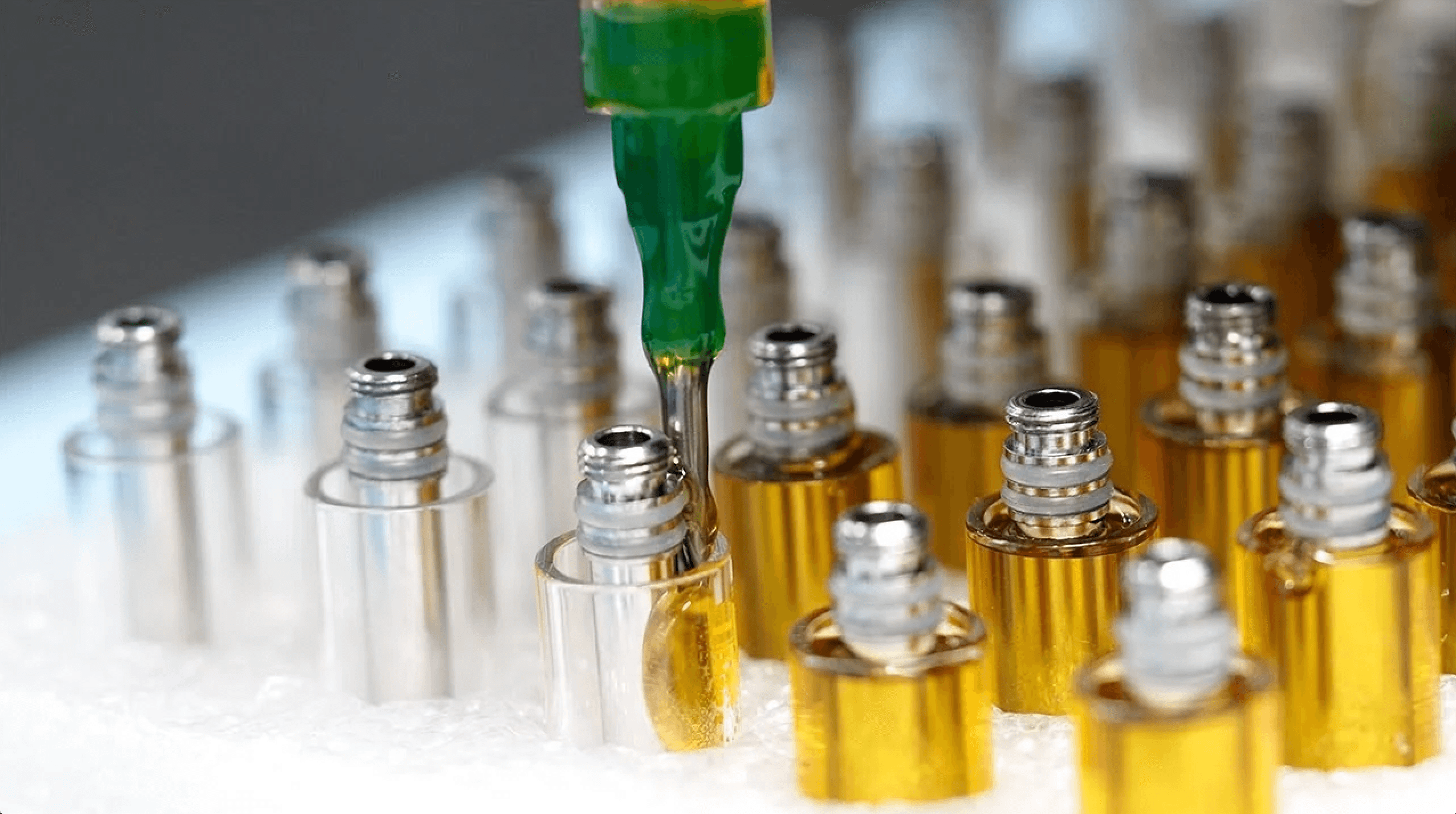 White label cannabis vape cartridges on the filling line at JIT Distro, Sacramento, California